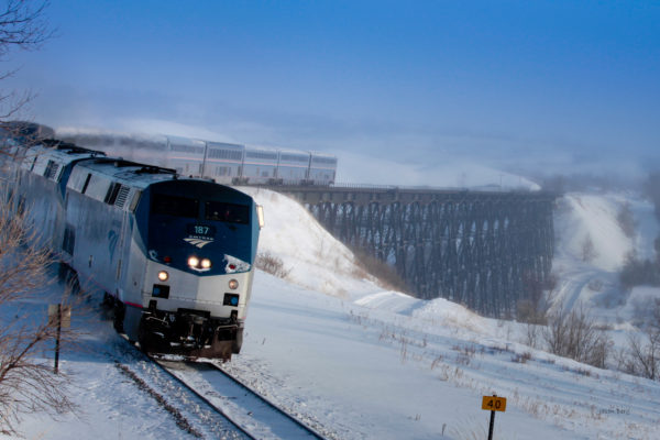 Amtrak’s Empire Builder travels across Gassman Coulee Trestle near Minot, N.D. during the winter. The Empire Builder travels daily between Chicago and the Pacific Northwest (Seattle, Wa. and Portland, Ore.) along major portions of the Lewis and Clark trail.

Photo Credit: Amtrak / Jason Berg