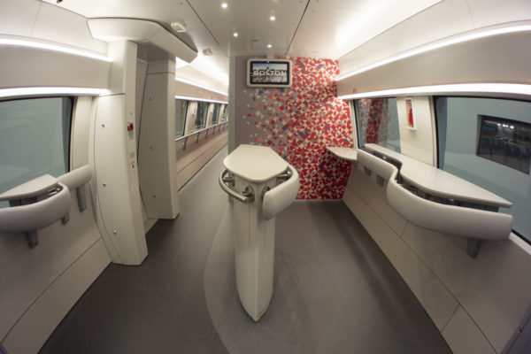 The Café Car features a nest area, with standing room and hip rests. Digital screens throughout the café car provide useful, and state-of-the-art information to customers.