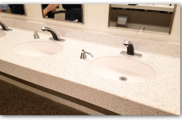 New deck-mounted, automatic-sensing sinks replaced the former individually-mounted sinks. New soap dispensers conform to both ADA- and ICC/ANSI-required reach ranges.​