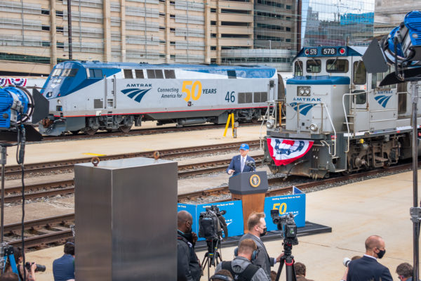 President Joseph R. Biden speaks at Amtrak's 50th Anniversary celebration with Locomotive 46 behind. Amtrak has full rights.