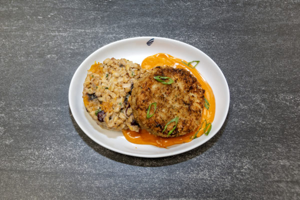 Lobster Crab Cake - 
Roasted lobster and crab cake over butternut squash, farrow and craisin salad with Sriracha crème