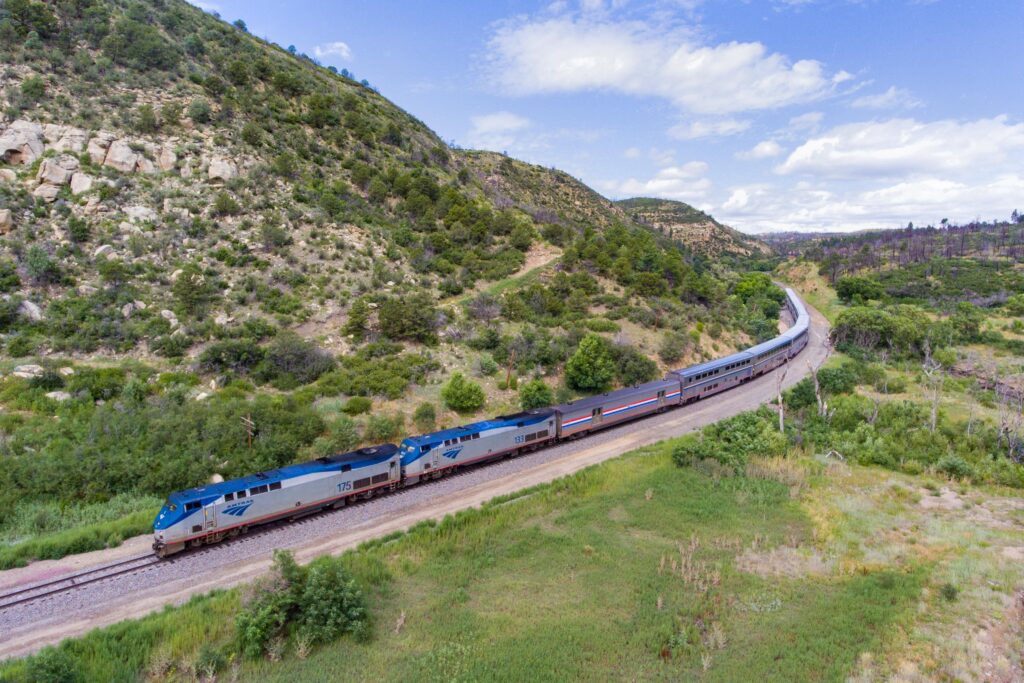 Southwest Chief train traveling through a vast green landscape