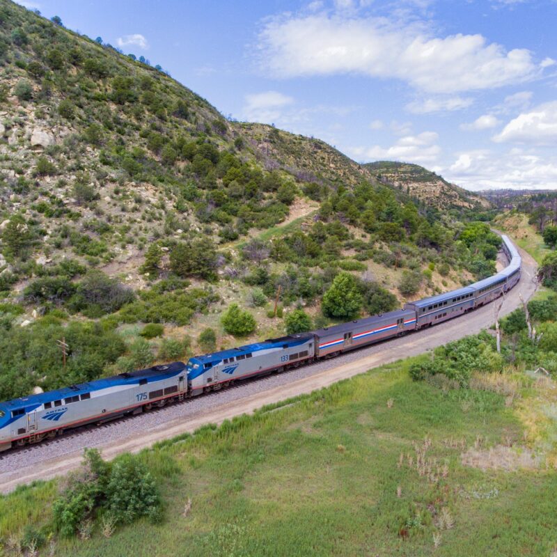 Southwest Chief train traveling through a vast green landscape